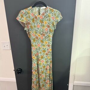 boutique dress with back cut out and high slip size small